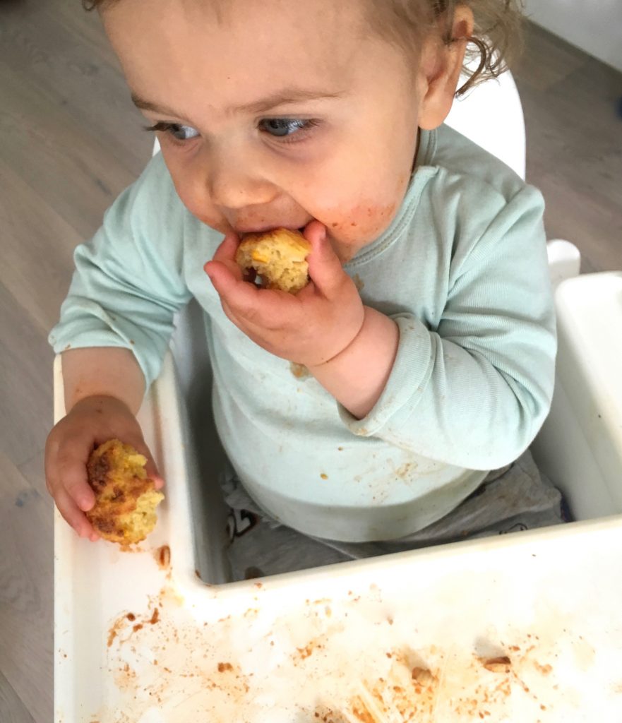 Nino eating Cheesy Cornbread Muffins - 1